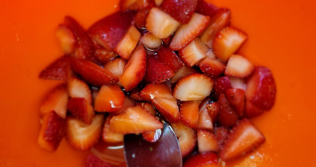 Strawberry Shortcake features fresh macerated strawberries with citrus and sugar. 