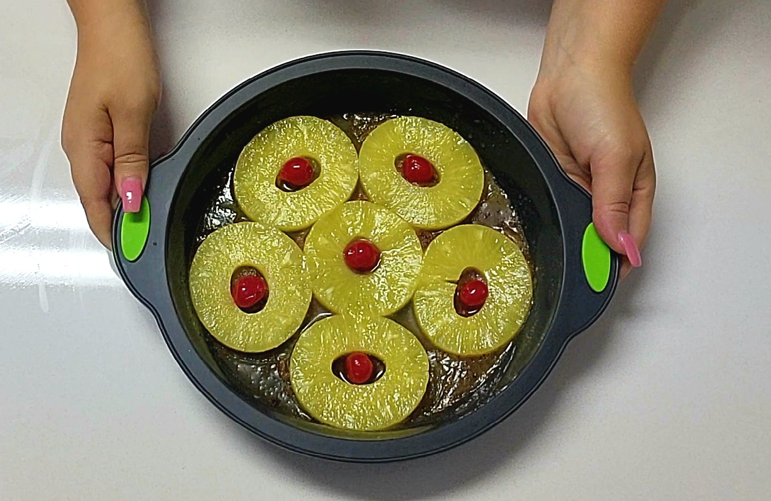 Pineapple Rum Upside Down Cake with canned pineapples and maraschino cherries.