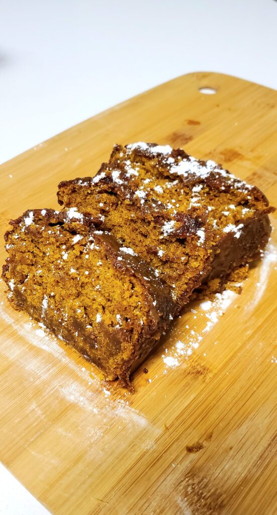 moist pumpkin bread dusted with powdered sugar