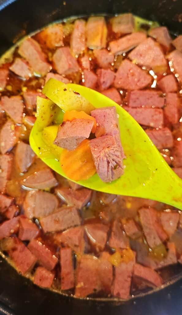 carrots and potatoes inside a sopa de salchichon