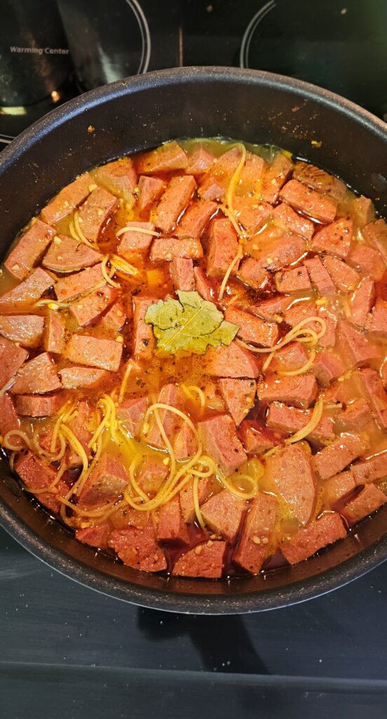 fideos or thin pasta inside the sopa de salchichon
